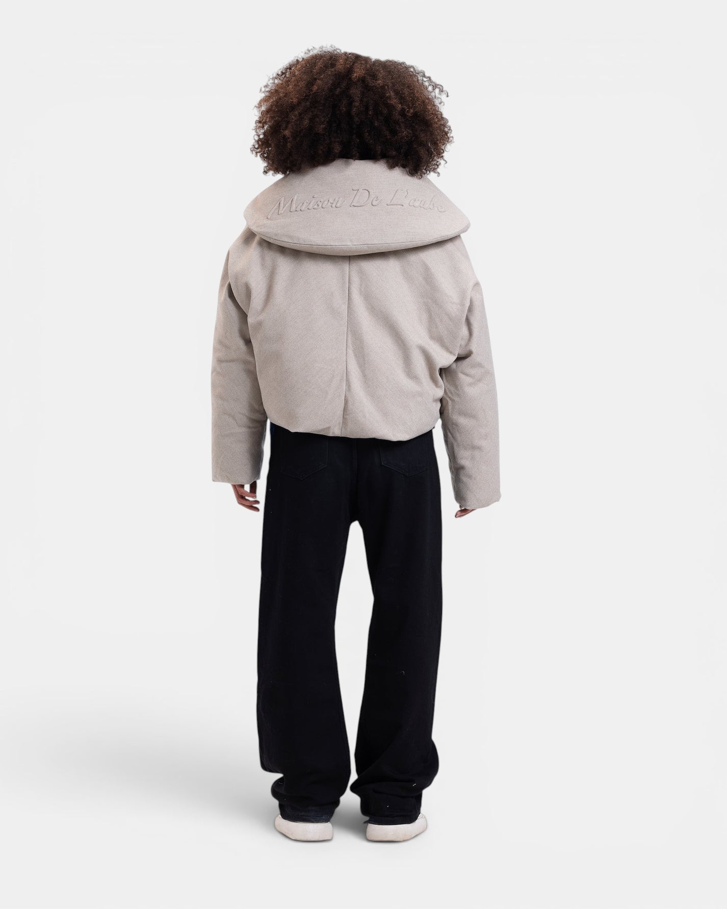 Maison De L'aube beige padded cropped jacket with oversized sculpted collar and embroidered logo on back.