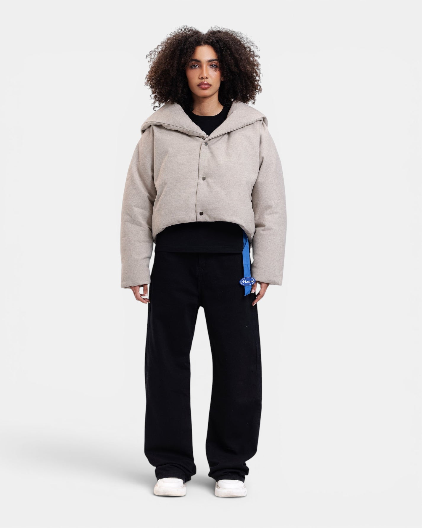 Maison De L'aube beige padded cropped jacket with oversized collar and snap button closure.