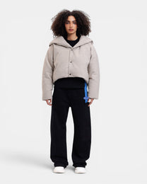 Maison De L'aube beige padded cropped jacket with oversized collar and snap button closure.